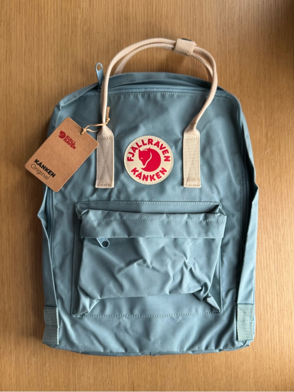 Fjallraven Kånken Backpack in sky blue with Cream Handles